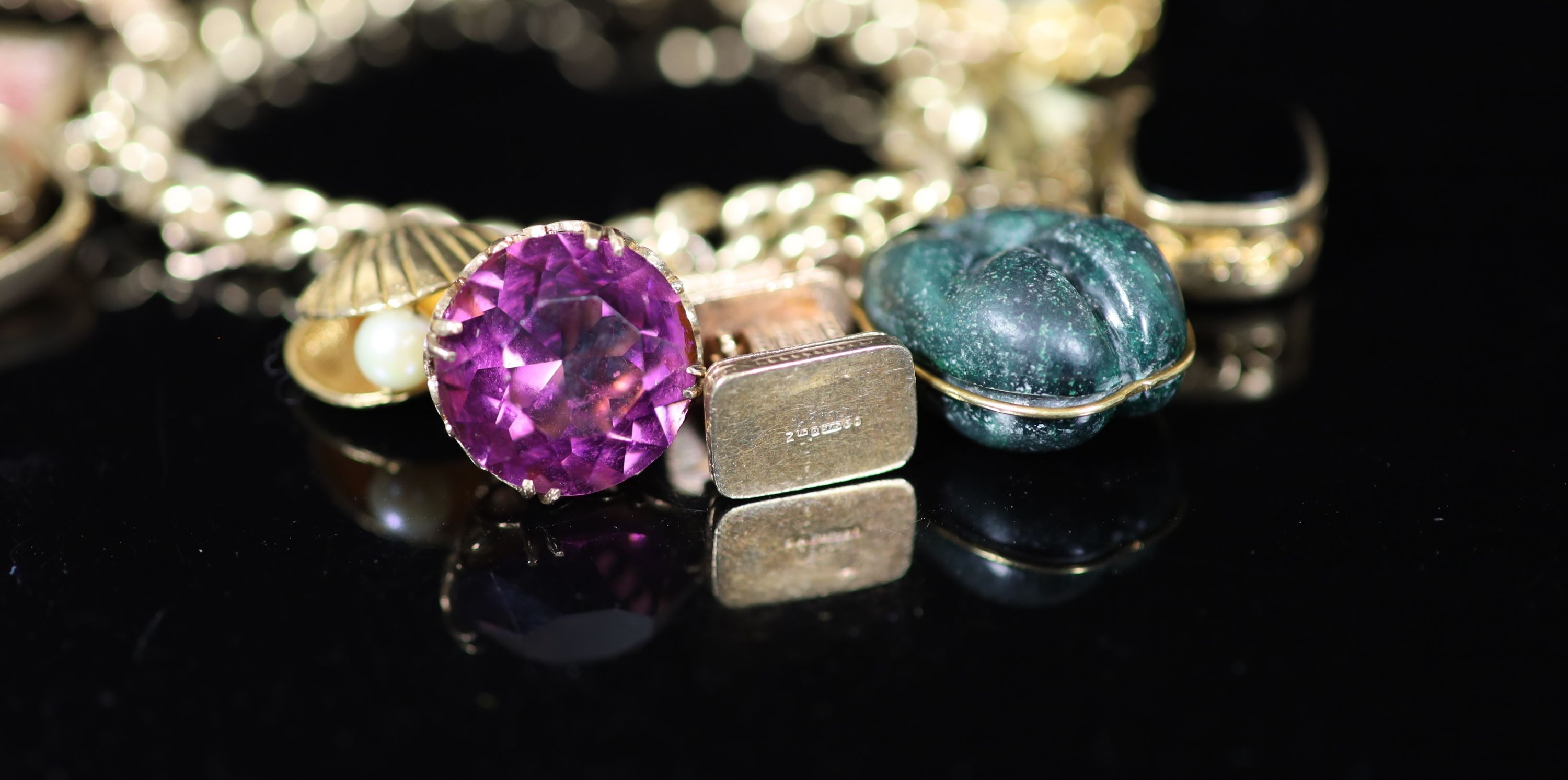 A 1970's 9ct. gold charm bracelet